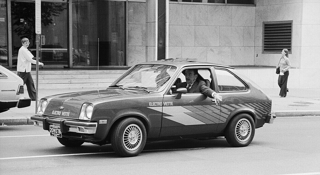 Man driving a Chevrolet Electrovette electric car, 1979