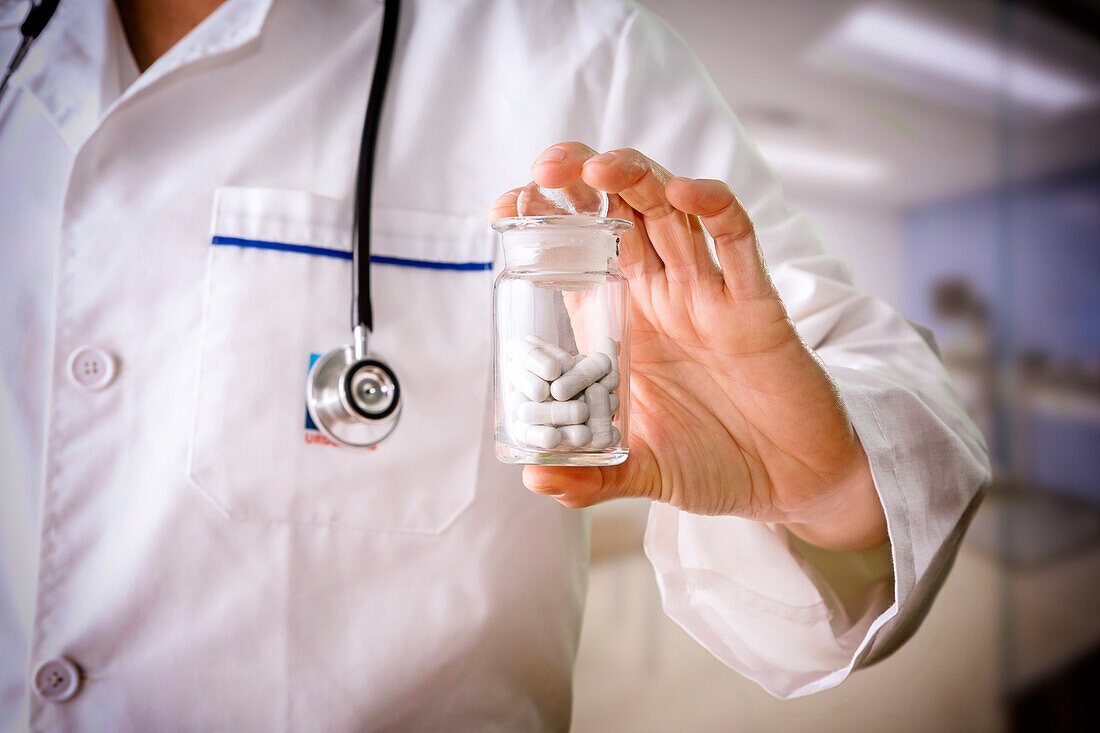 Doctor holding a pill container