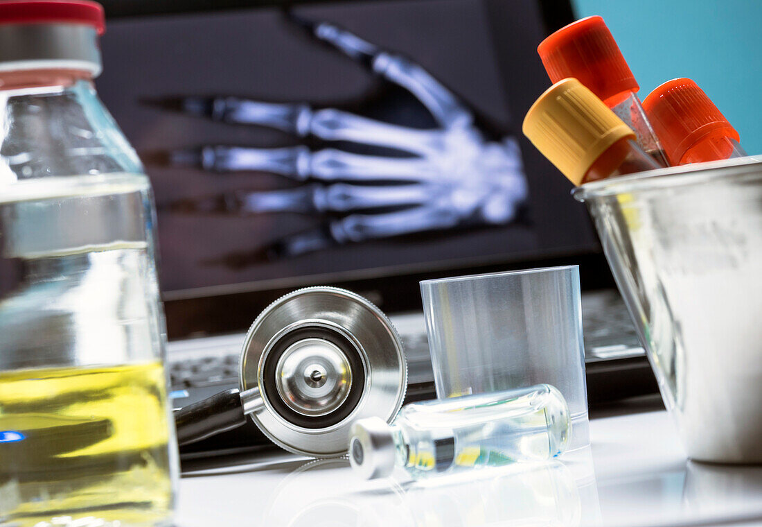 Phials and blood samples next to a stethoscope