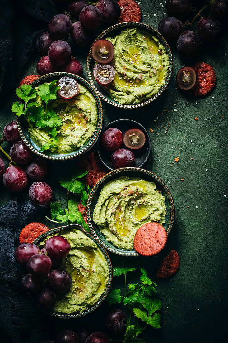 Hummus with cilantro and red grapes