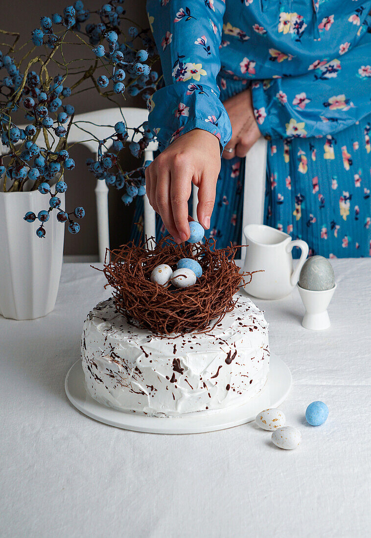 Easter cake decorated with a chocolate nest and Easter eggs