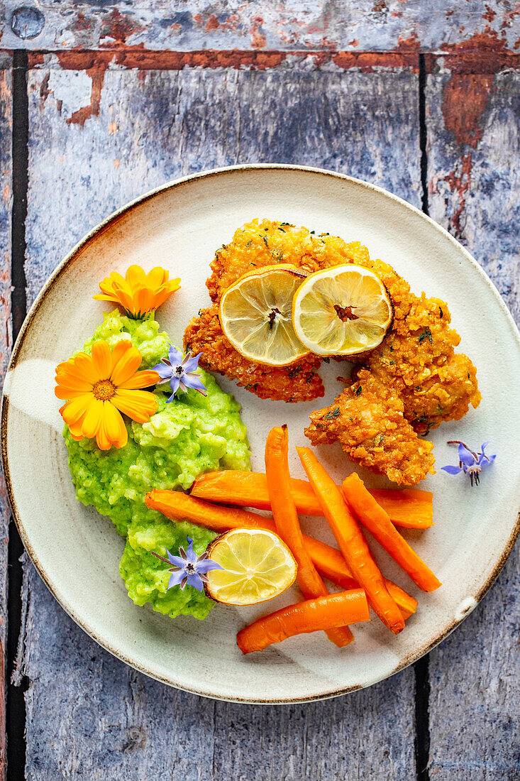 Chicken in cornflake breading with sweet potatoes and vegetable puree