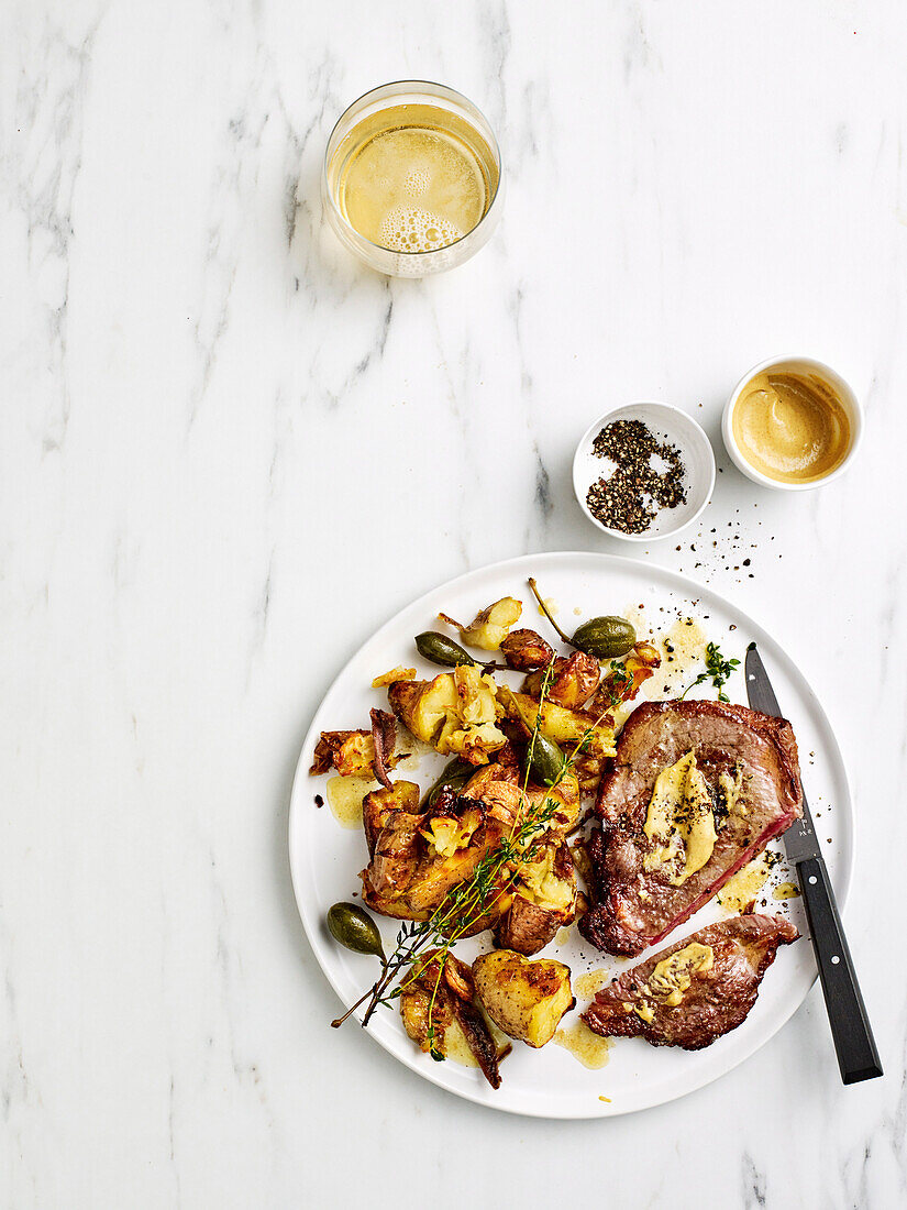 Minute steaks with Cafe de Paris potatoes