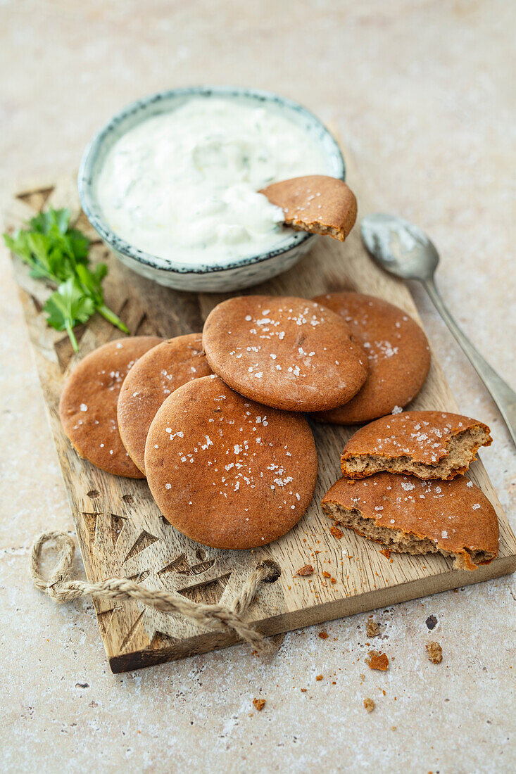 Crispbread disks made from rye and buckwheat flour with herby quark