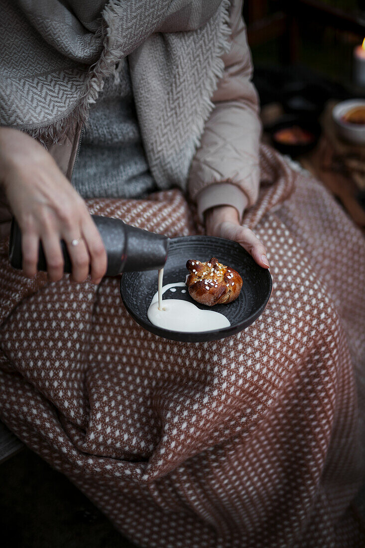 Kanelbullar (Swedish cinnamon rolls) with cream