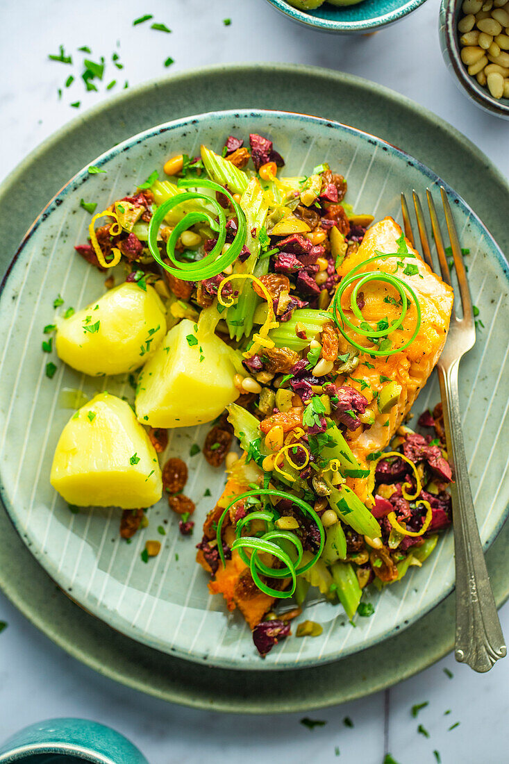 Roasted salmon with pine nuts, olive salsa and buttered potatoes