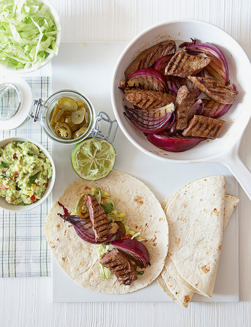 Steak and onion fajitas with sweetcorn salsa