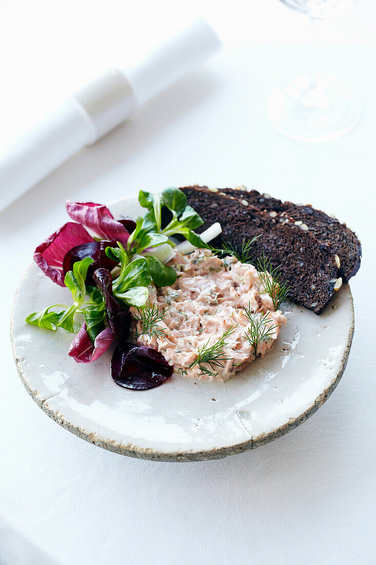 Warm salmon rillette, rye bread and beetroot salad