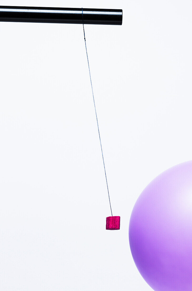 Pith ball and charged balloon