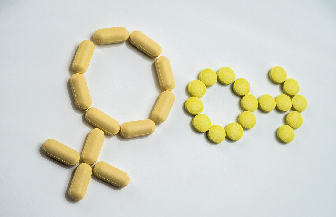 Female and male symbols formed with pills