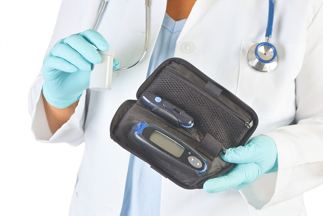 Doctor holding diabetic supplies