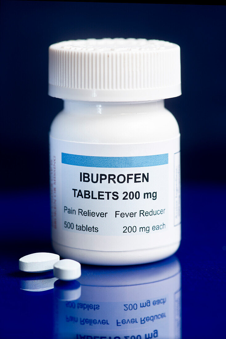 Ibuprofen container and two tablets