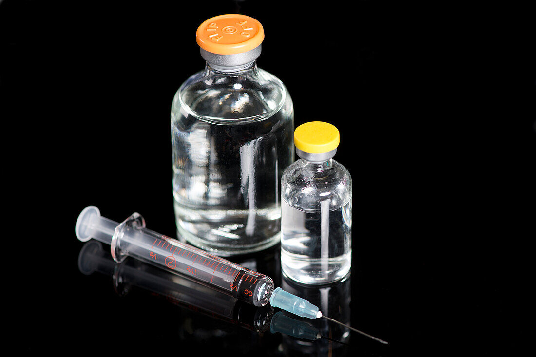Large medication vials with syringe