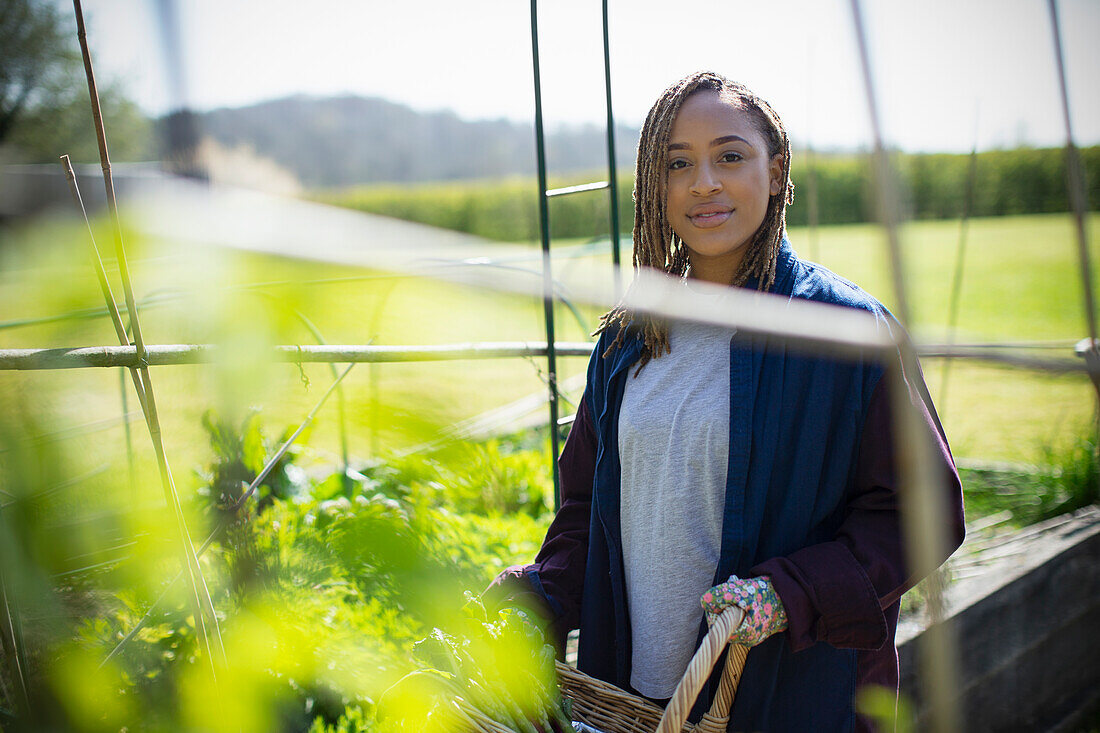 Young woman gardening in sunny garden