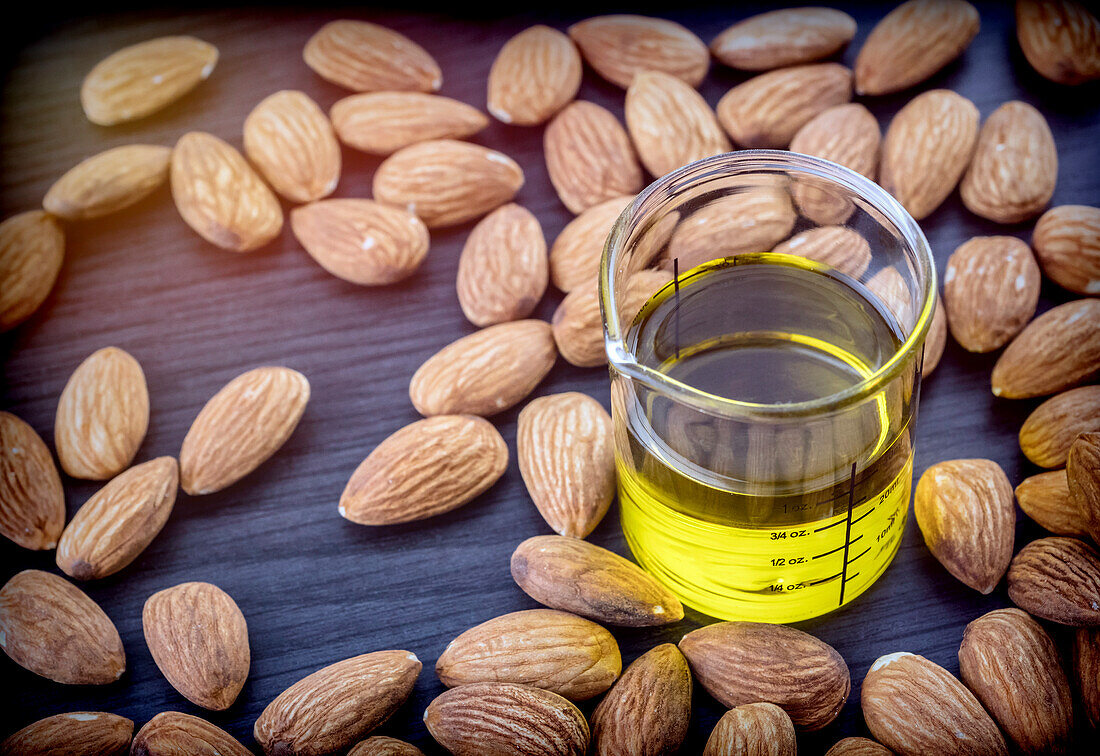 Essential almond oil on a wooden table