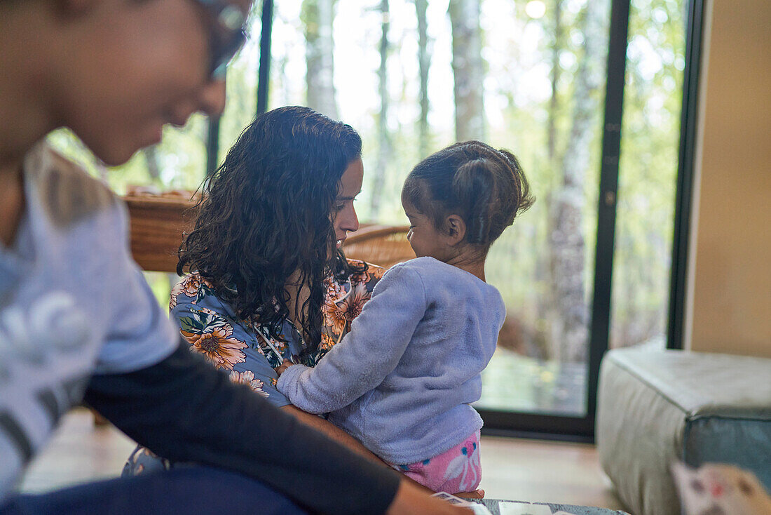 Mother talking to toddler daughter