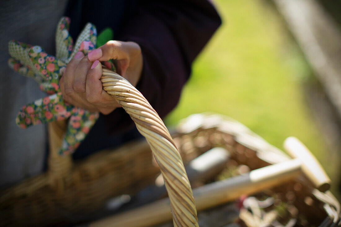Close up woman holding gardening basket
