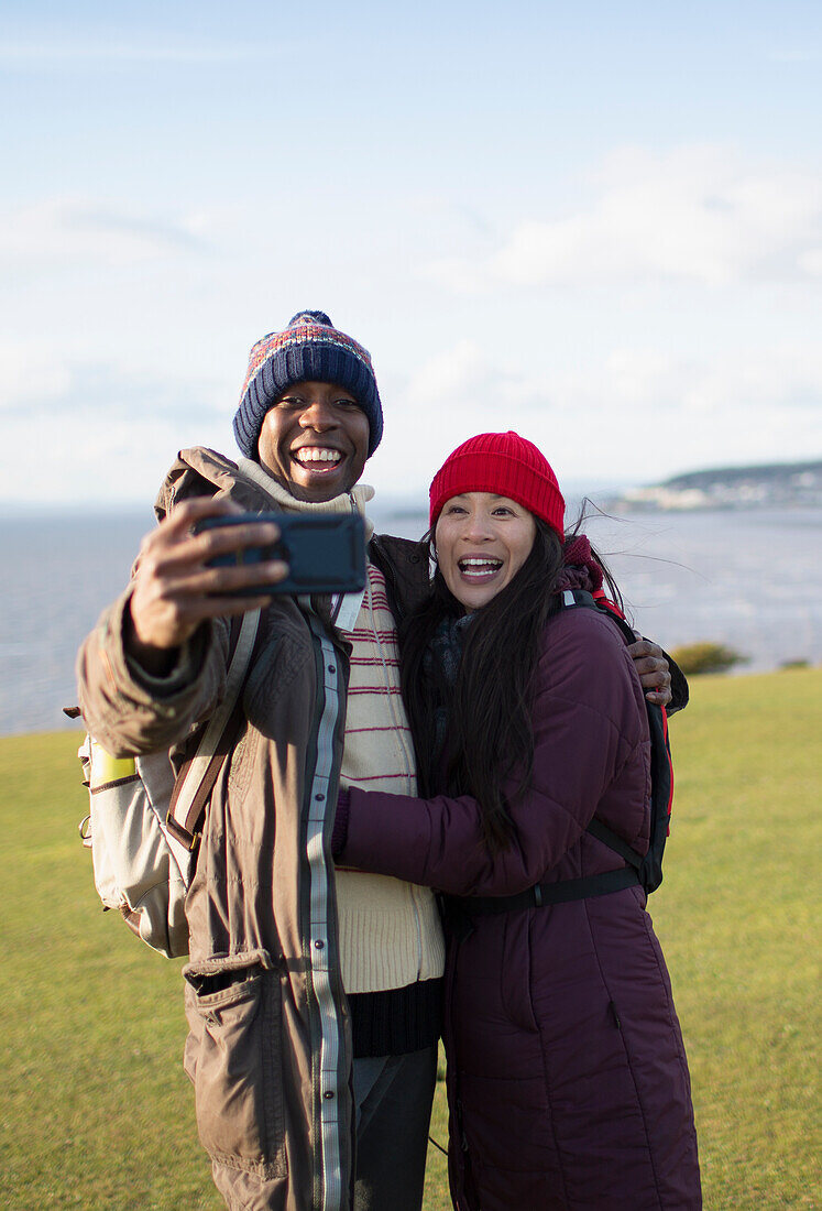 Happy hiker couple taking selfie
