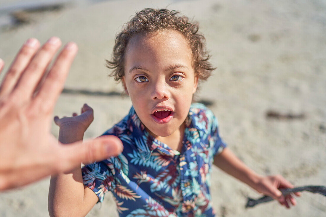 Boy with Down Syndrome high fiving