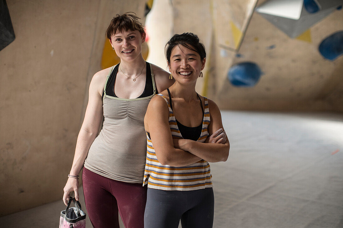 Female rock climbers in climbing gym