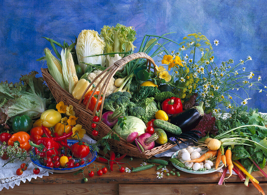 Different kinds of vegetables in and around a basket