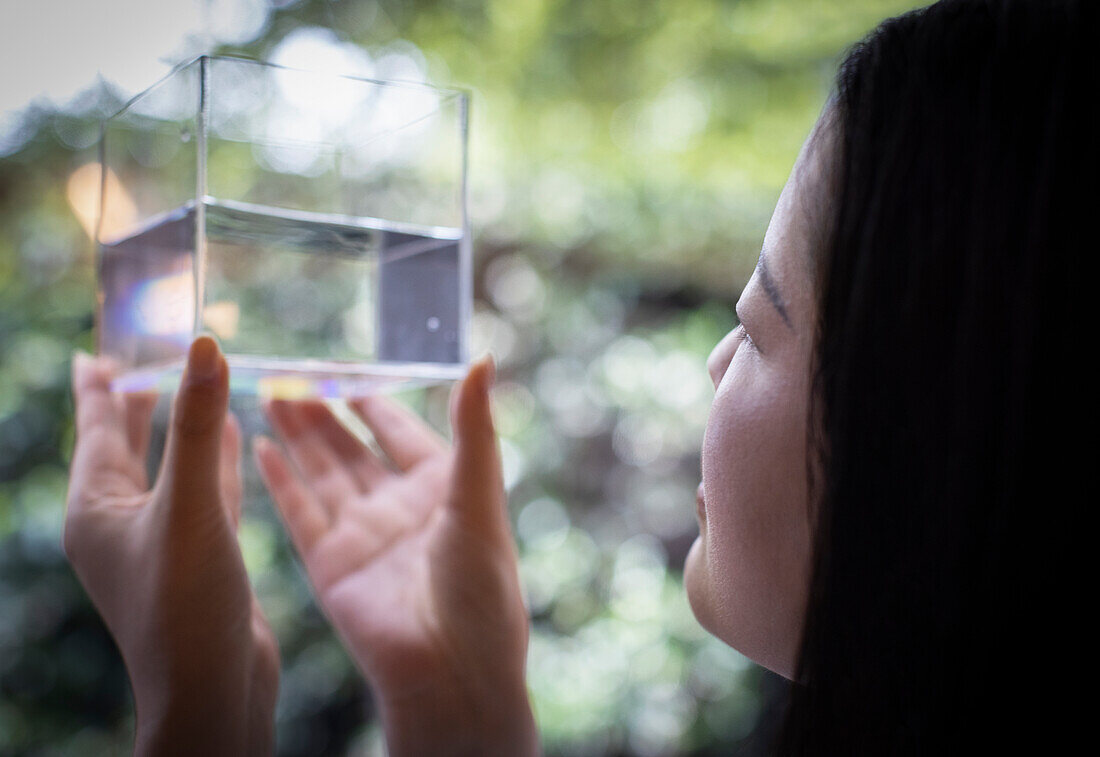 Woman holding cube with water