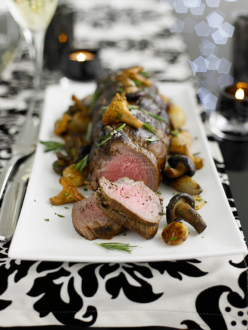 Roast fillet of beef with shallots and mushrooms