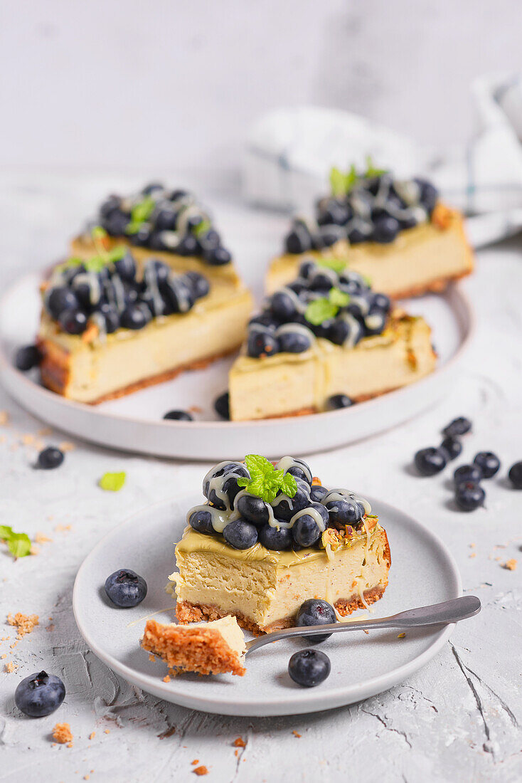Pistachio cheesecake with blueberries and white chocolate
