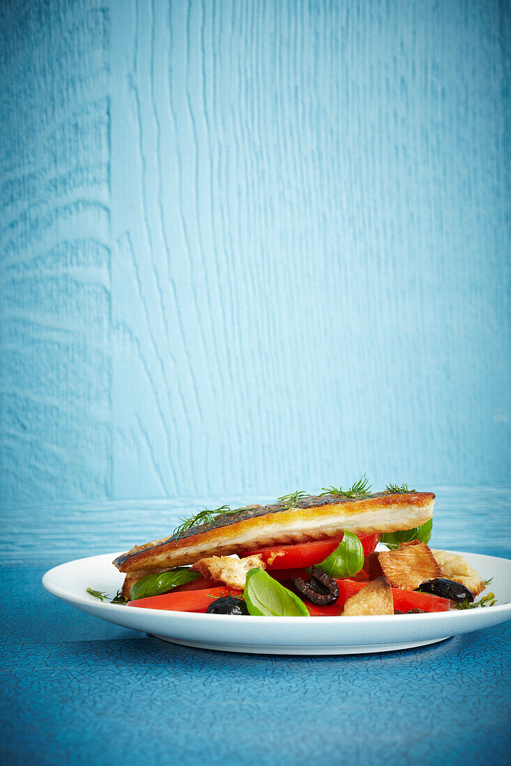 Lemon and dill bream with ciabatta tomato and olive salad