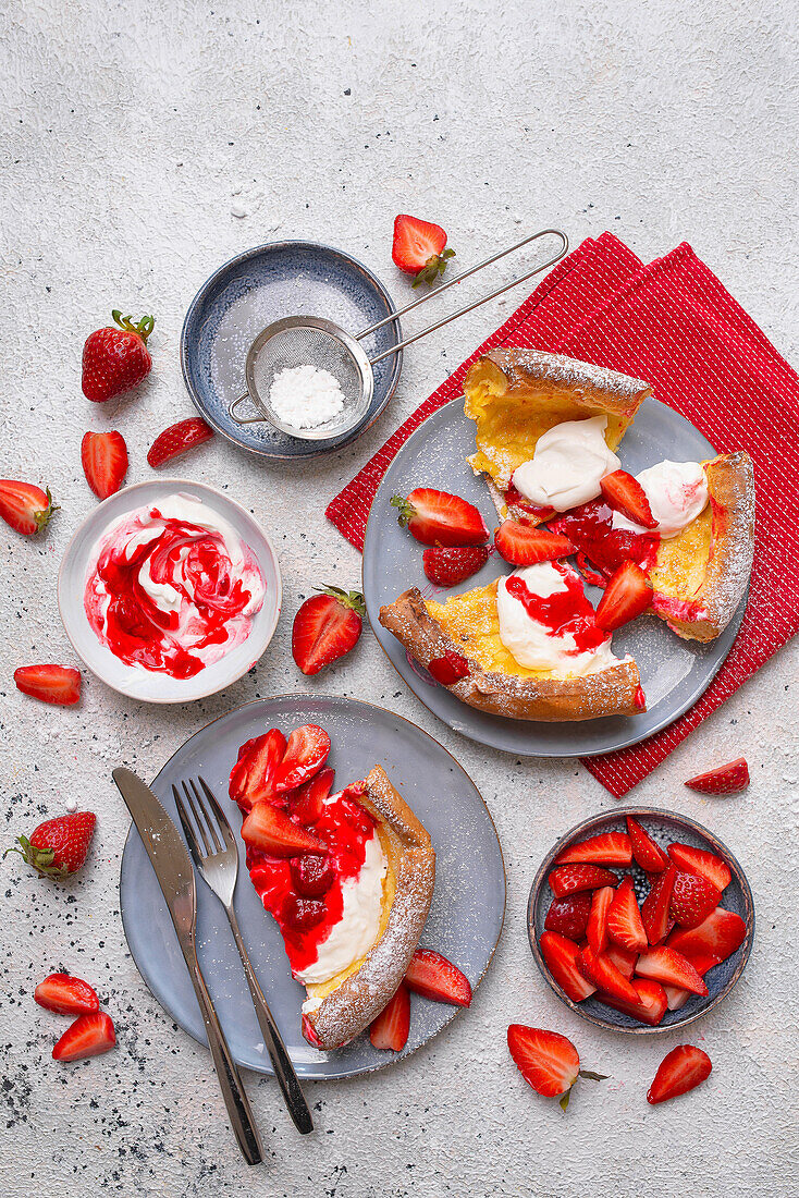 Dutch baby slices with strawberries and yoghurt