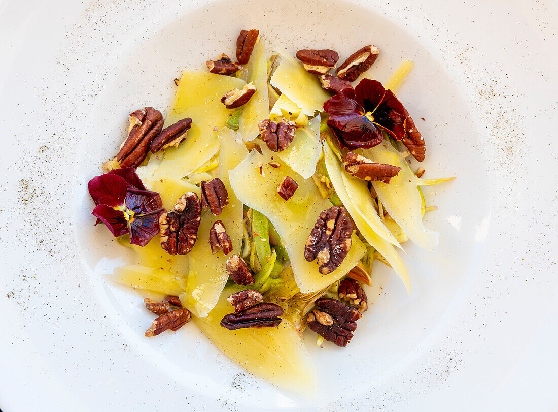 Lemon-scented artichokes with shaved Sbrinz cheese and roasted nuts