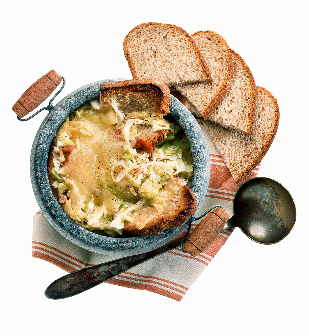 Zuppa Valpellinese (Italian cabbage soup topped with bread and cheese)