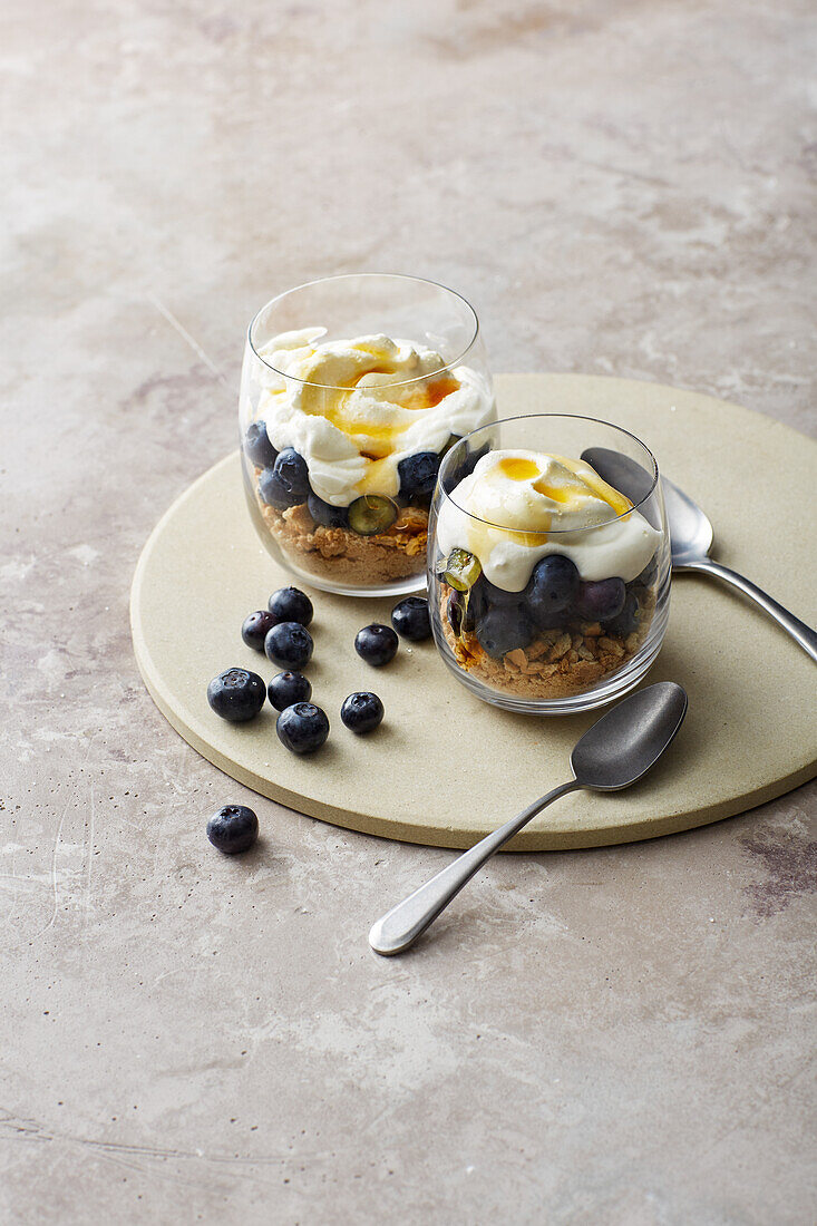 Blueberry tiramisu in a glass with goat's yoghurt cream