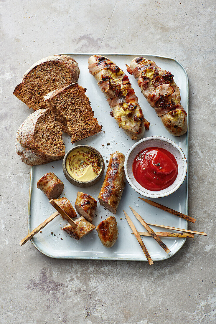 Grilled sausage duo with bread and dips