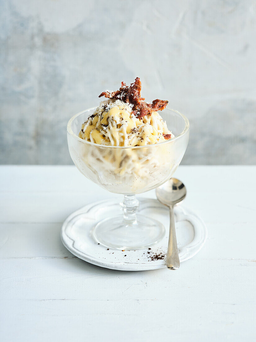 Spaghetti ice cream with egg liqueur, Oreo biscuits, white chocolate and ham