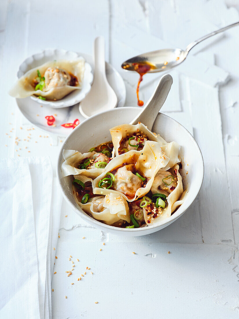 Spicy Szechuan wontons with minced meat filling and chilli oil