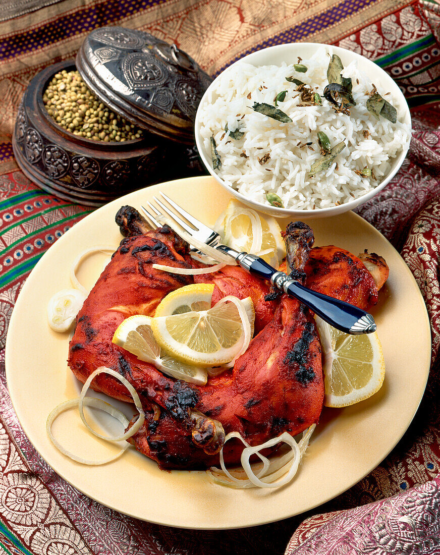 Indian tandoori chicken served with rice