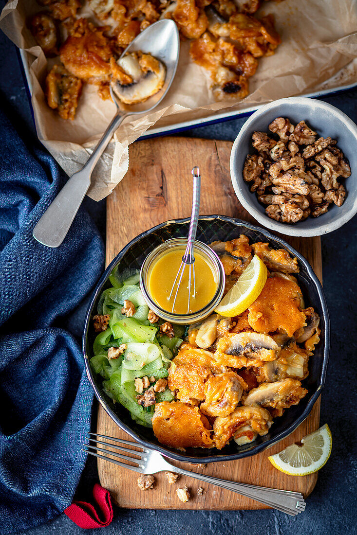 Beer battered mushrooms with nuts and mustard-honey dressing