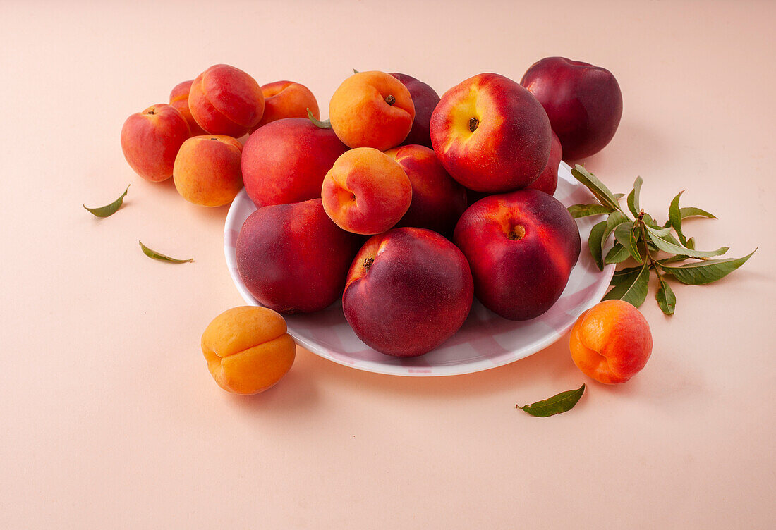 Peaches and apricots on the background