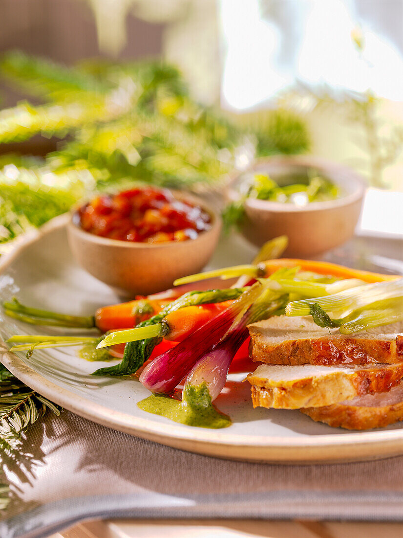 Roast veal with sautéed vegetables and dips