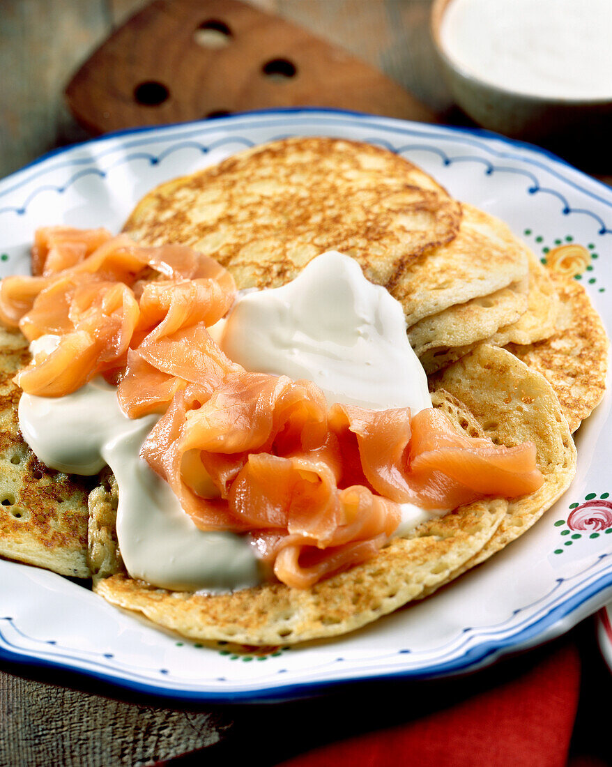 Rice pancakes with salmon and sour cream