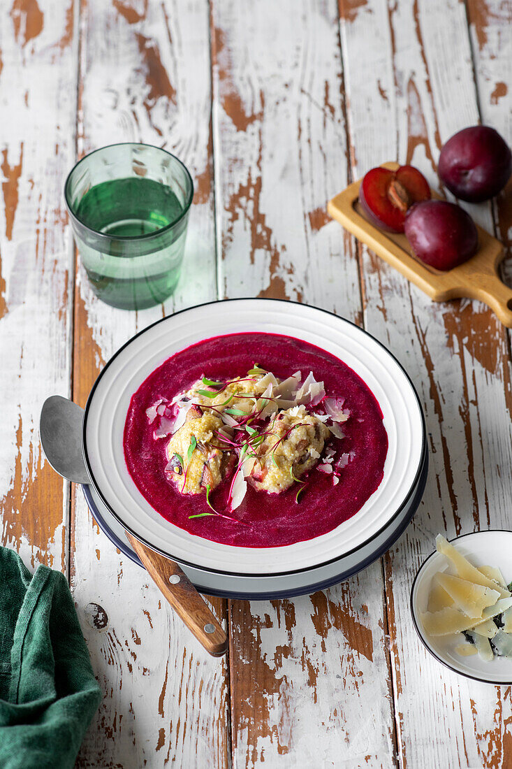Beetroot soup with plums and polenta dumplings