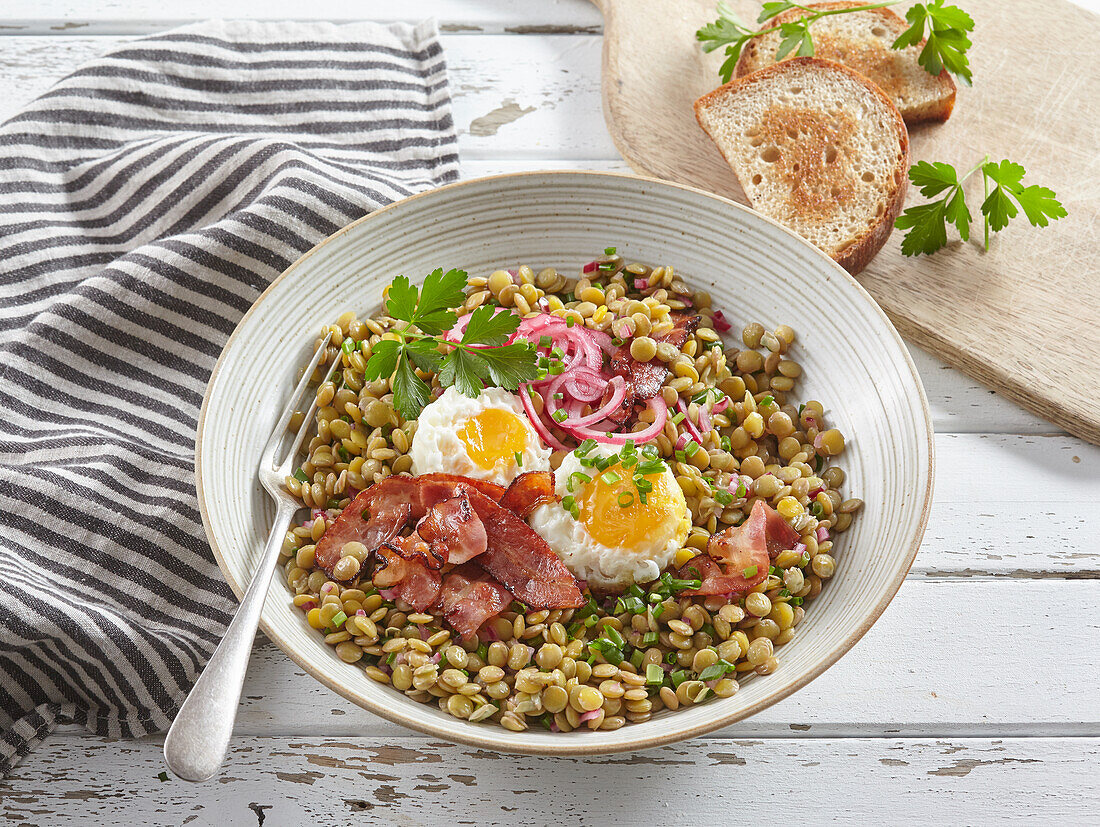 Lentil stew with egg and bacon