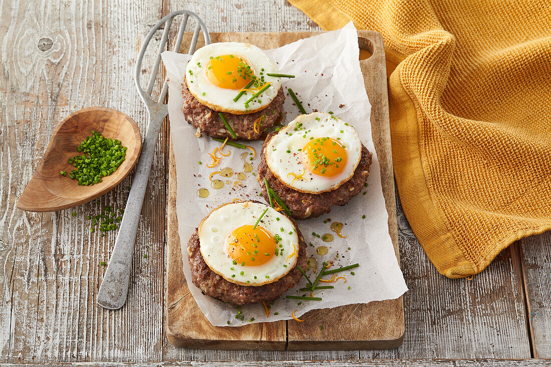 Beef patties with sunny side up egg