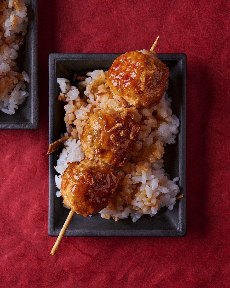 Caramelised chicken skewer on rice