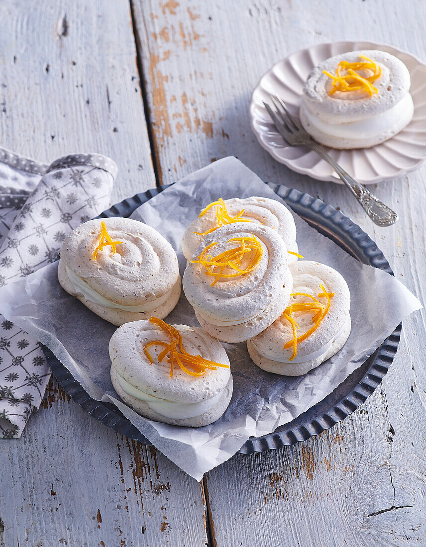 Meringues filled with orange whipped cream