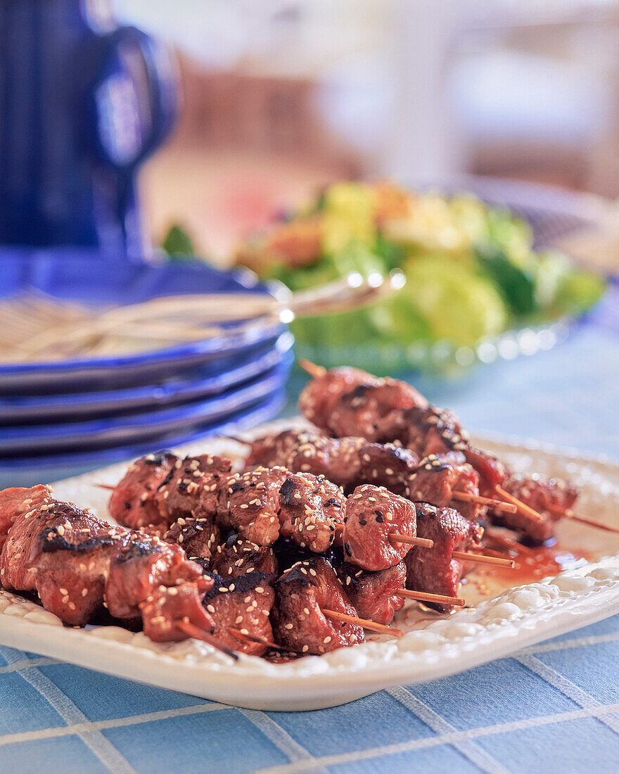 Duck skewers with sesame