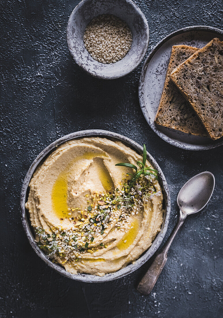 Hummus with bread and sesame
