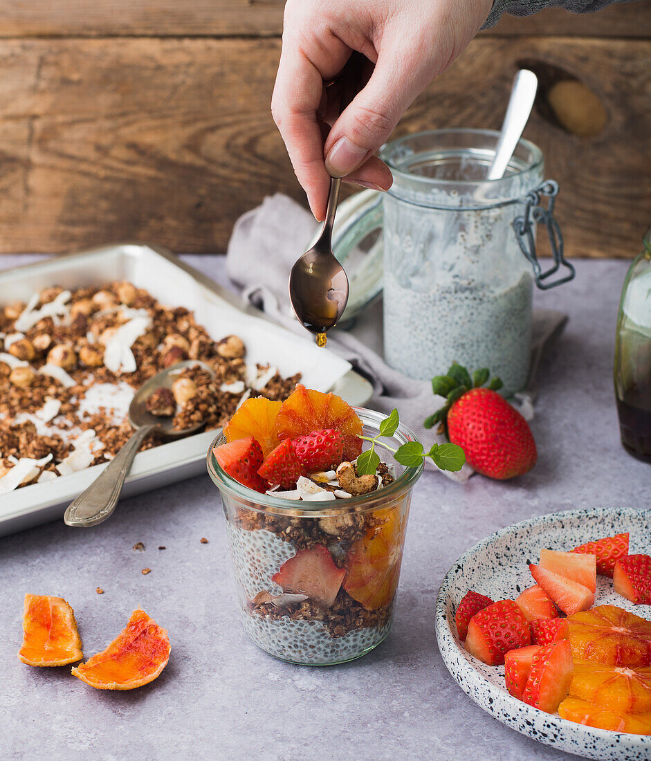 Chia pudding with strawberries, blood oranges and granola cereal