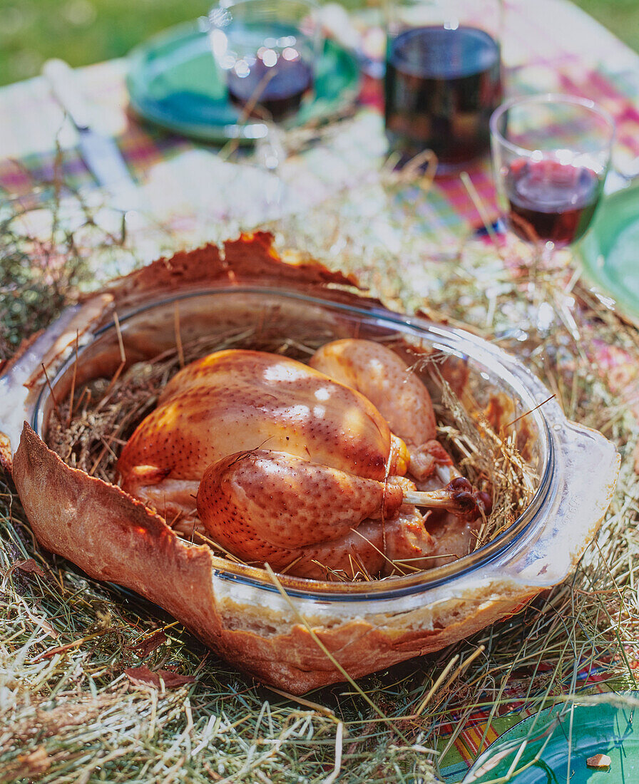 Chicken cooked in hay